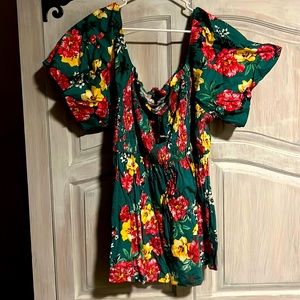 Colorful off the shoulder top. Buff like sleeves. Nice popping colors.